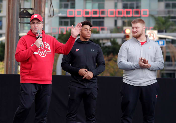 Paul Chryst speaking before the Rose Bowl with Jonathan Taylor and Tyler Biadasz.